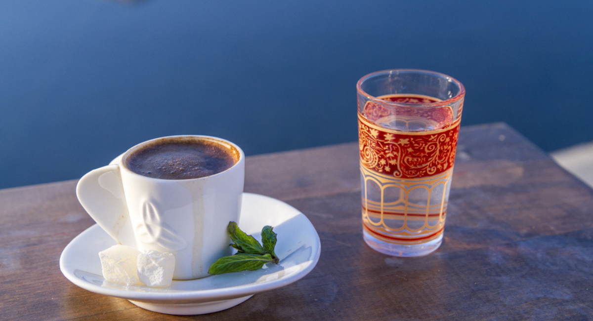 Turkish coffee served with Turkish delight, mint leaves and water