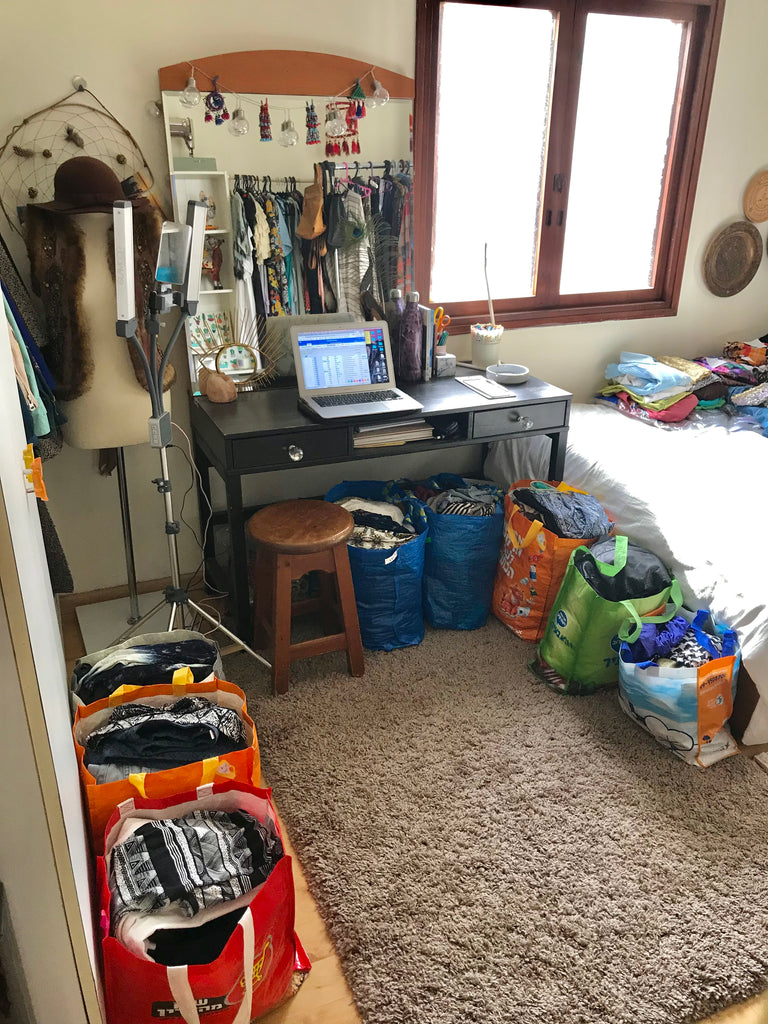 Danielle's college bedroom was filled with an array of bags containing secondhand clothes ready for sale, creating a bustling hub for her entrepreneurial venture.