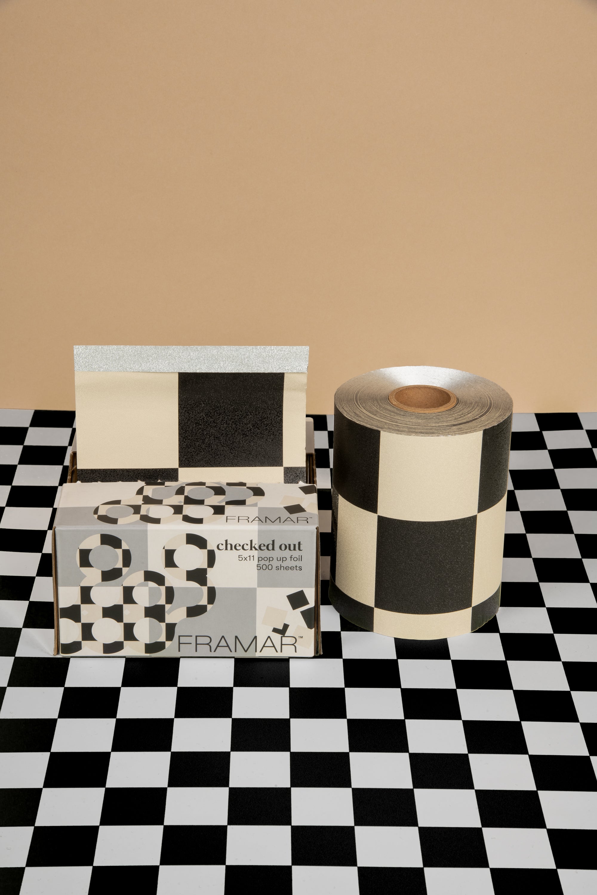 Salon foil products on a checkered surface with a beige backdrop.