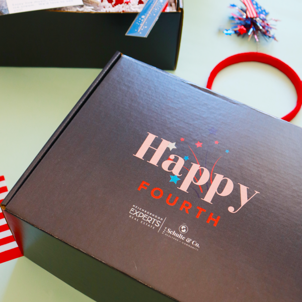 Custom branded corporate Fourth of July party kit gift box for top Gig Harbor Real Estate Agent Paige Schulte