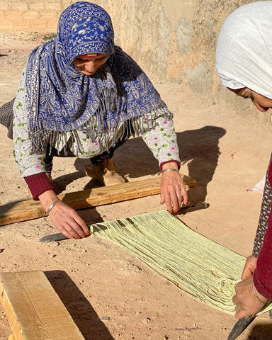 Khatima making a loom