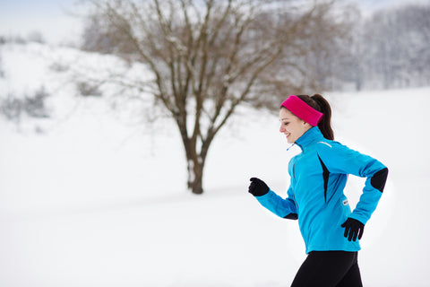 athlete-woman-is-running-during-winter-training-outside-in-cold-snow-weather