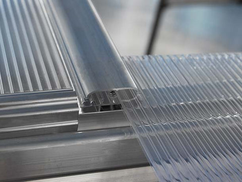 Polycarbonate panels slide in assembly for greenhouse construction