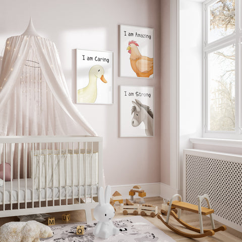 Set of 3 farm animal prints with I am affirmations above them, hung next to a crin in ababies nursery