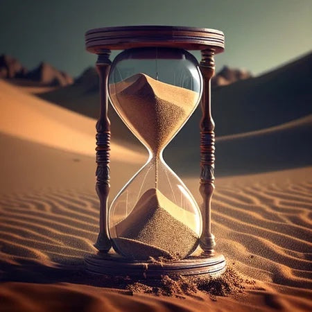 Hourglass on the background of the desert with sand a symbol of life