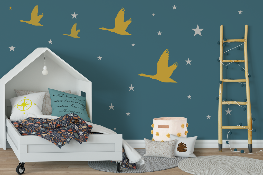 Cozy bedroom with flying geese and stars on wall.