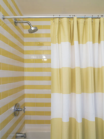 yellow and white tile striped shower with a yellow and white striped shower curtain... Trending in Bathroom Design: Yellow Bathrooms from Bathroom Bliss by Rotator Rod