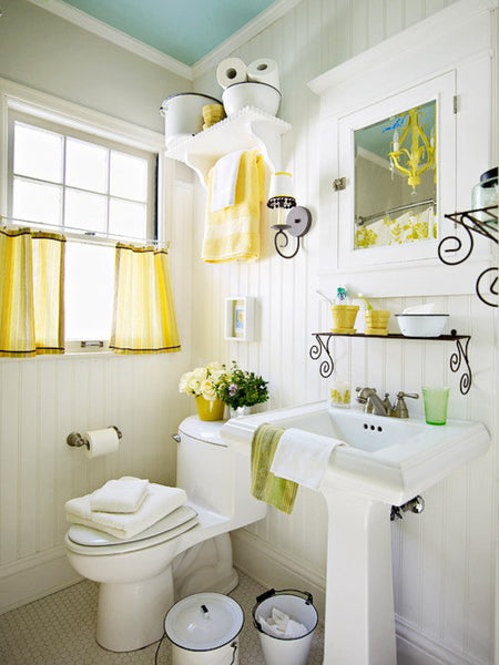 quaint white bathroom with yellow linens and accents... Trending in Bathroom Design: Yellow Bathrooms from Bathroom Bliss by Rotator Rod