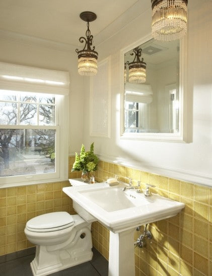 elegant white bathroom with half wall of square yellow tile and antique chandeliers... Trending in Bathroom Design: Yellow Bathrooms from Bathroom Bliss by Rotator Rod