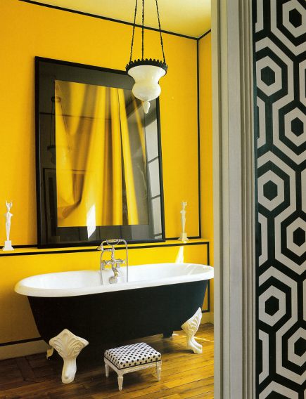 eclectic bold yellow bathroom with black claw foot bathtub and yellow and white accents... Trending in Bathroom Design: Yellow Bathrooms from Bathroom Bliss by Rotator Rod