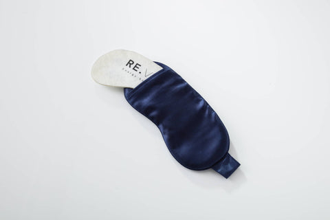  A navy blue silk sleep mask to help improve sleep quality