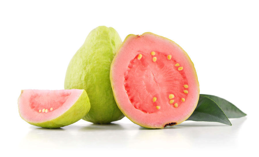 Whole and cut pink guava fruits
