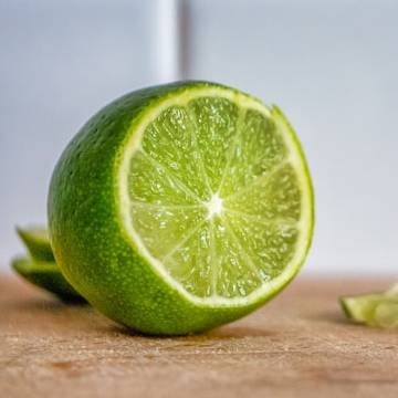 sliced lime on wooden table