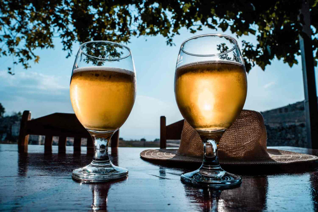 Two glasses of gose beer on an outdoor table