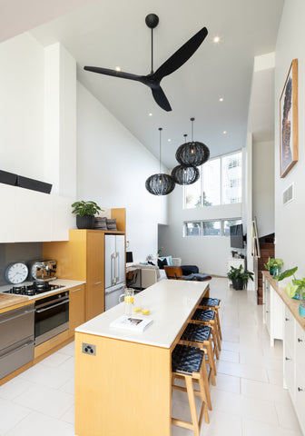 Black downrod mount ceiling fan in kitchen