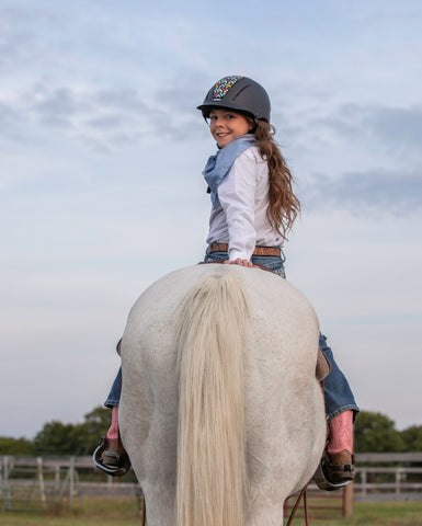 western horse riding helmet girl on white horse