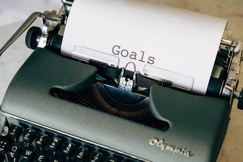 GOALS spelled out on a piece of paper in an old typewriter
