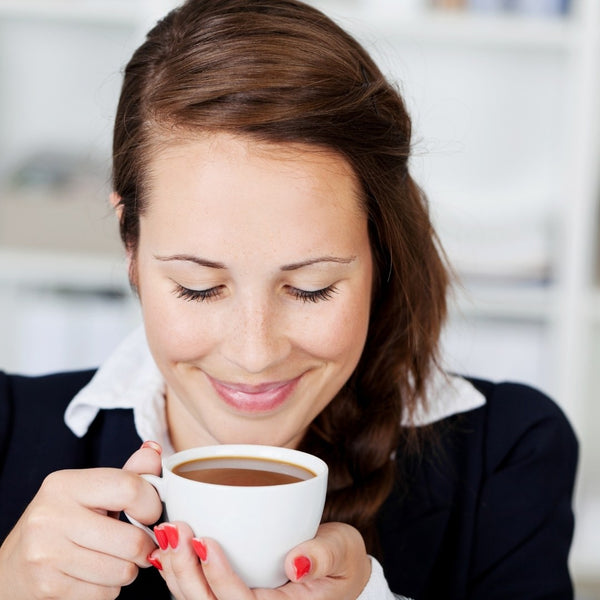 Woman drinking coffee with stevia