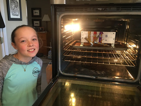 Ella testing the 3D prints resistance to heat inside the oven