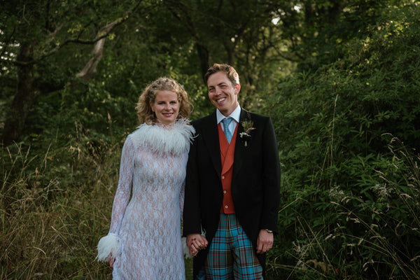 A bride and groom in the woods