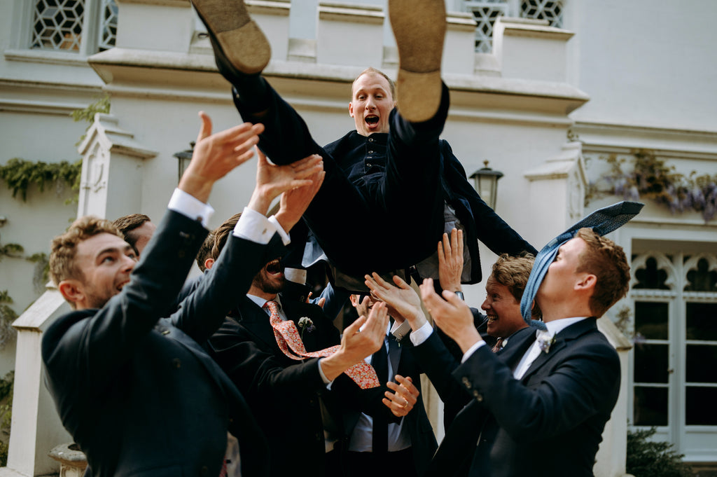 Throwing groom up in the air