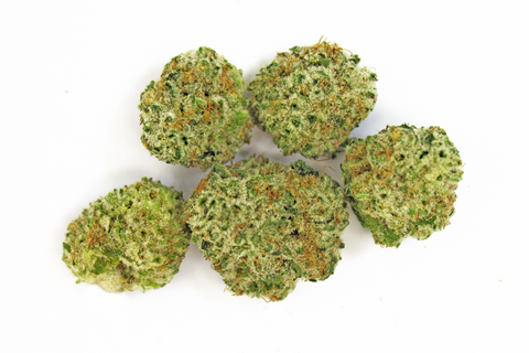 One gram of cannabis nugs on a white background