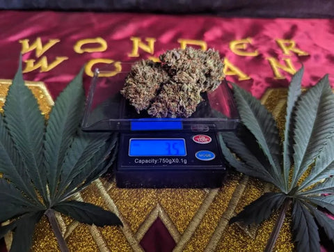 An eighth of marijuana on a scale
