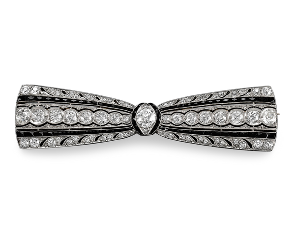 Art Deco-period diamond and onyx "bow" brooch by Greenleaf & Crosby