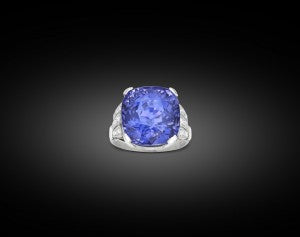 This gem is a brilliant blue color outdoors, but takes on a purplish hue under incandescent light