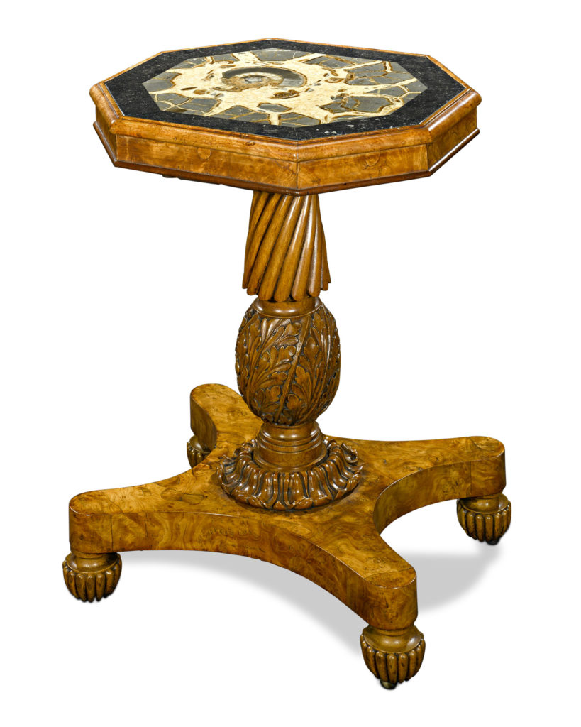 The Regency Fossil and Burl Elm Pedestal Table.