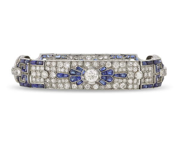 This Art Deco-period sapphire and diamond bracelet features a geometric design of diamonds and sapphires. (https://rauantiques.com/collections/art-deco-jewelry/products/art-deco-diamond-and-sapphire-bracelet-1?variant=39761494671495)
