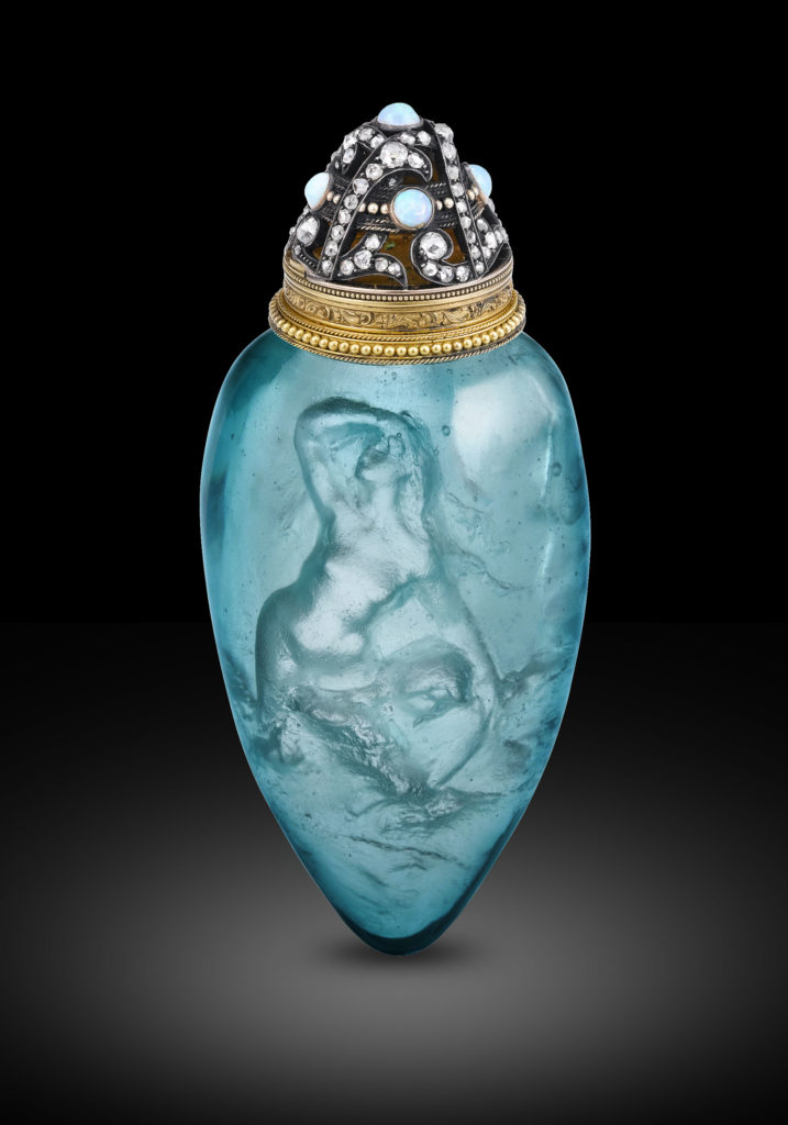 René Lalique Sirènes Cire Perdue perfume bottle. Circa 1905. An incredible rarity in the oevure of the great René Lalique, this Sirènes perfume bottle is believed to be one of only four known examples the master of glass ever created. Known as a flacon à senteur, or scent bottle, this wondrous objet d'art also marks the dawn of Lalique's work crafted à la cire perdue, or in the lost wax technique.
