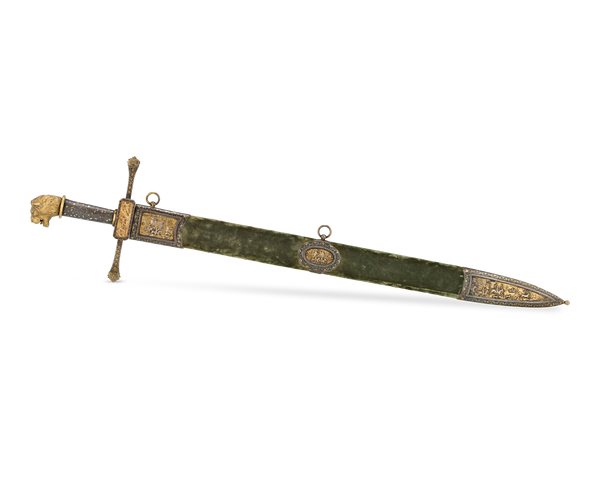 European Gilded Hunting Sword. Circa 1830. M.S. Rau, New Orleans. The decorative accents on this sword mark it as a status symbol for its owner, including a green velvet scabbard and lion’s head pommel.