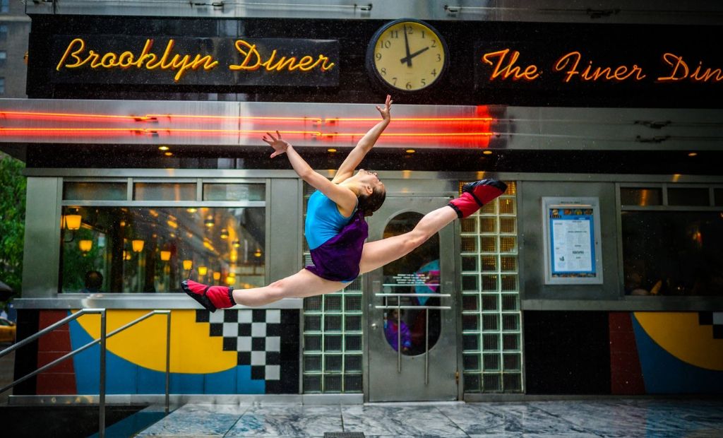 A BLOCH dancer leaping through New York City wearing BLOCH Back to School essentials, shot by Jordan Matter