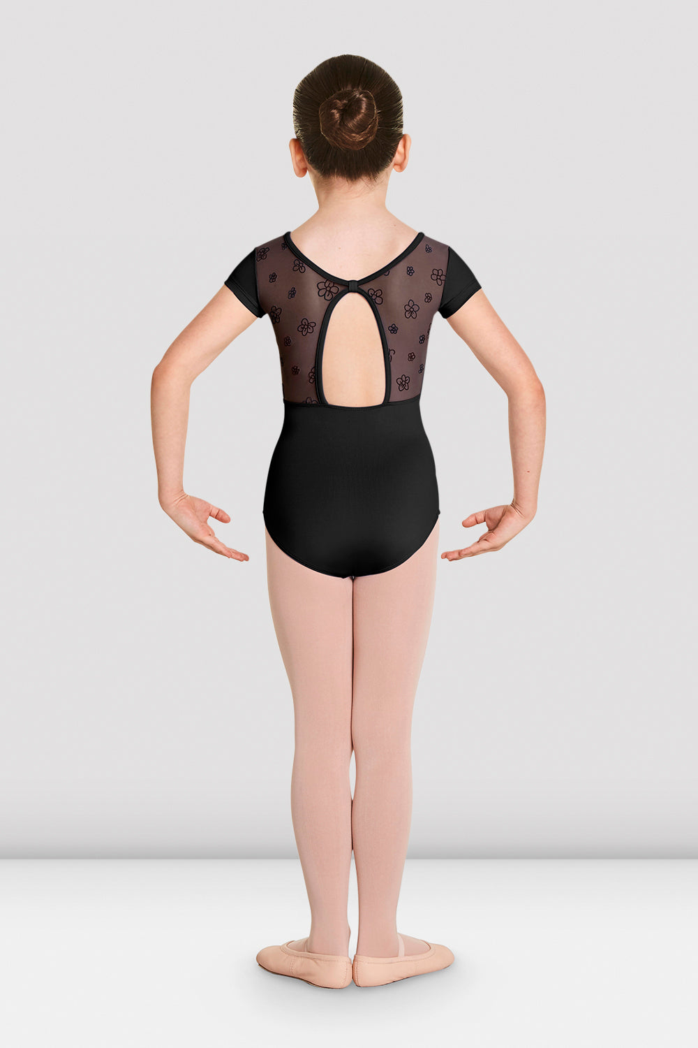 The back of a young female ballet dancer wearing the Girls Antheia short sleeve sweetheart leotard