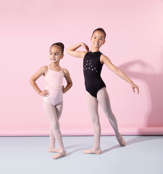 Two young ballet dancers posing in leotards