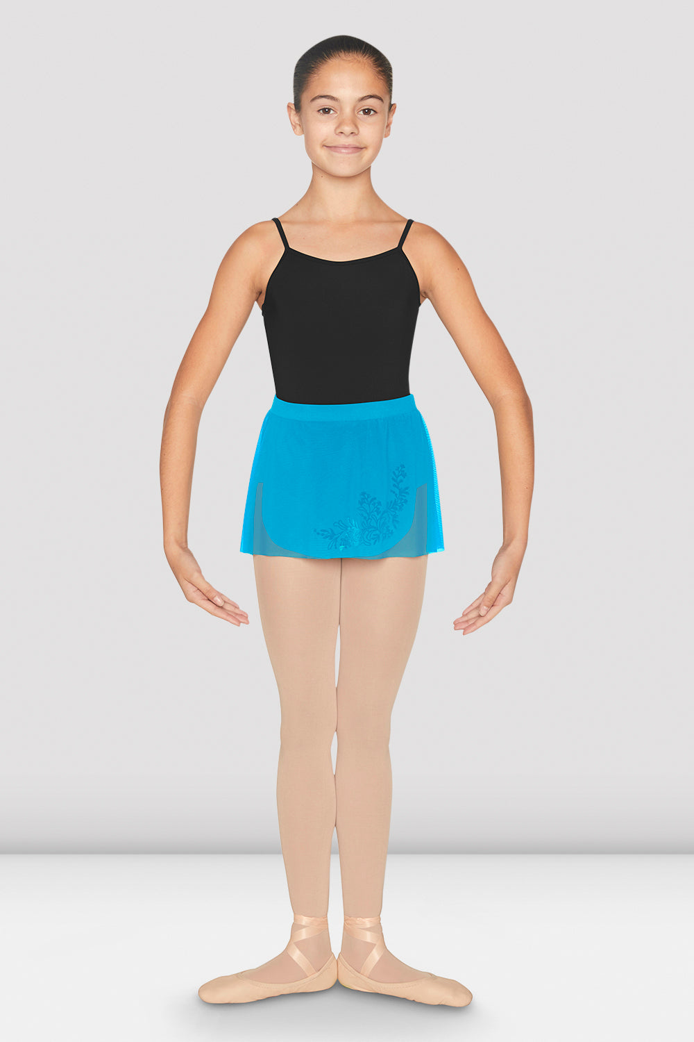 A young female dancer wearing the BLOCH Kristina wrap skirt