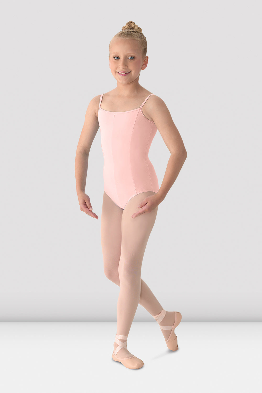 A young ballet dancer dancing in the girls Mirella camisole leotard in pink