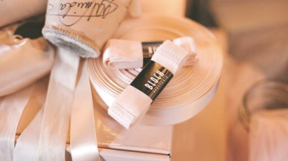 BLOCH pink ballet ribbon with a signed pair of pointe shoes