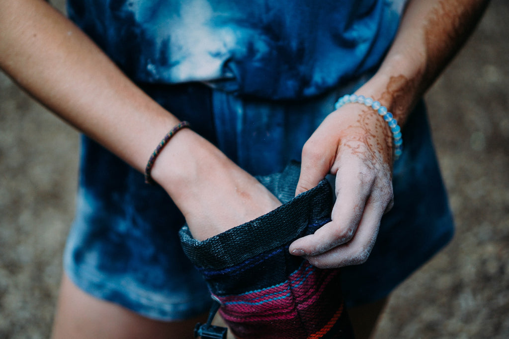 Climber holding chalk bag