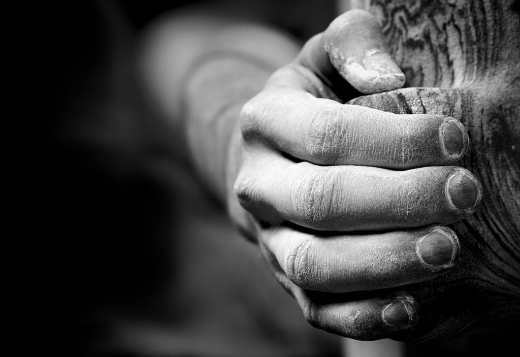 Climber hand on climbing hold