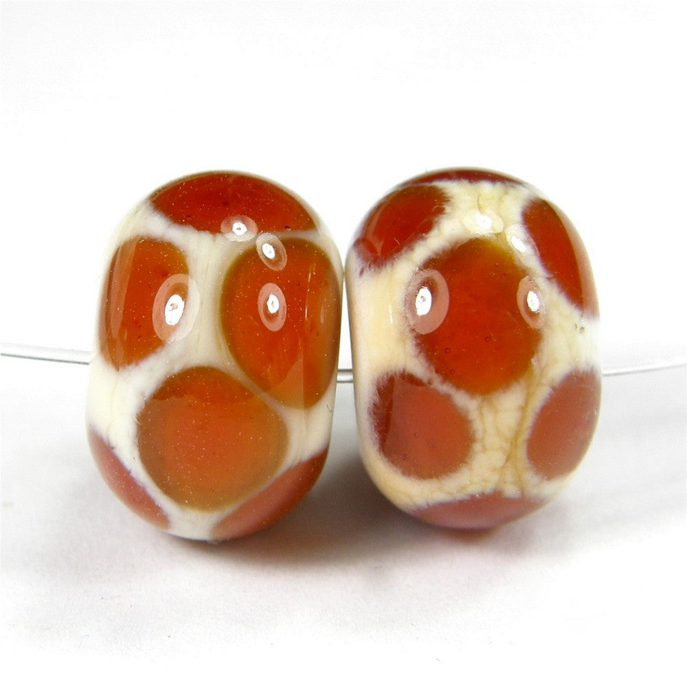 https://covergirlbeads.com/collections/handmade-lampwork-glass-dot-beads/products/handmade-lampwork-glass-dot-beads-ivory-medium-amber-shiny