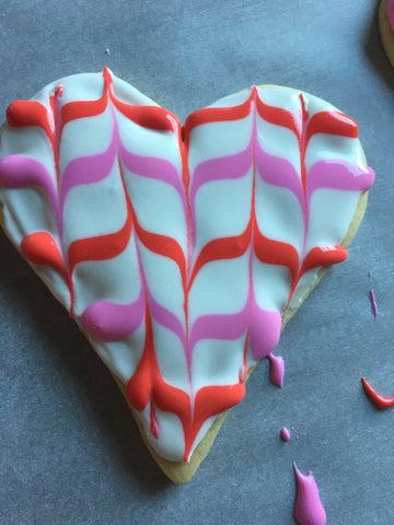 decorating heart sugar cookies with royal icing