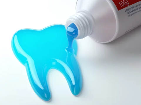 a blue toothpaste dripping out of tube and forming a tooth shape