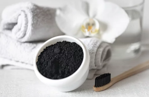 activated charcoal and a toothbrush