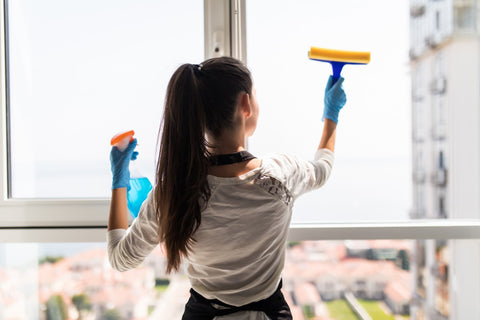 a woman cleaning the window