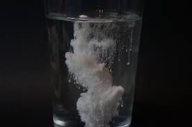 white powder in a glass of water
