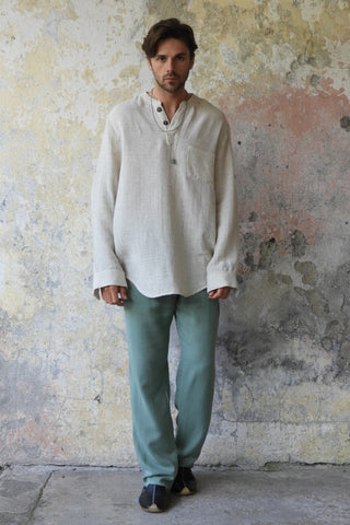 man wearing odanas pants and shirt