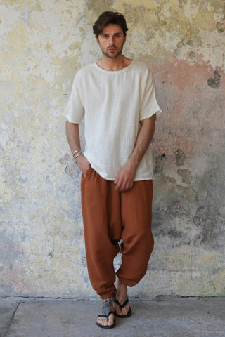 man wearing odanas brown pants and shirt