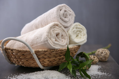white-cotton-face-towels-in-basket-natural-theme